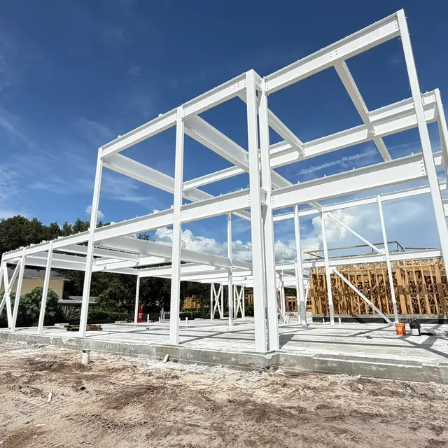 White-painted steel frame of a new two-story build