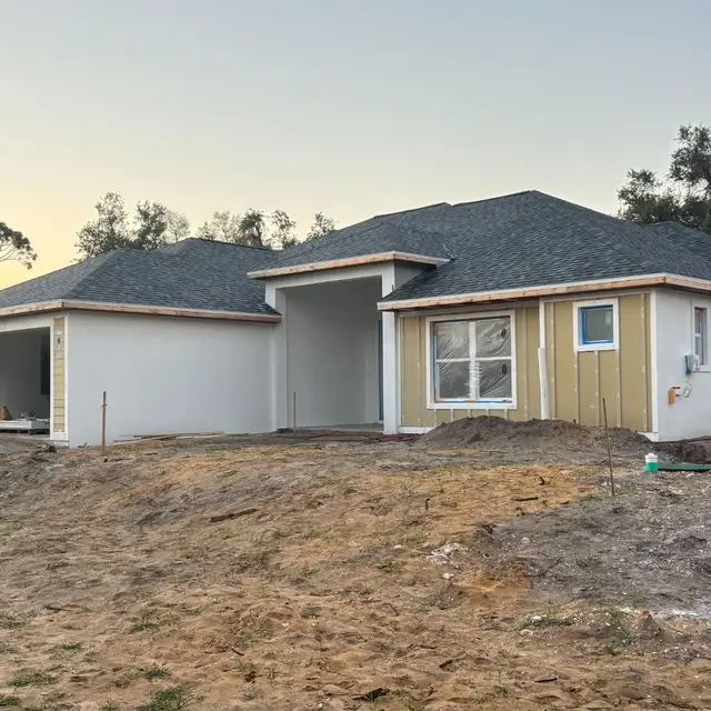 New-construction single-story home with fresh exterior paint
